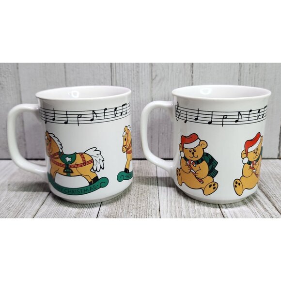 Vtg Christmas Coffee Tea Mugs Teddy Bear & Rocking Horse Music Notes Set Of 2 - Picture 1 of 5